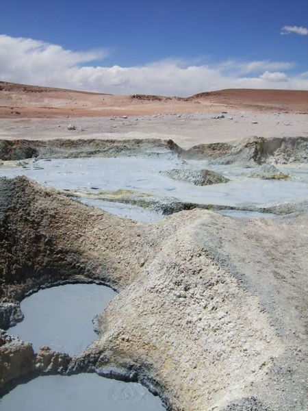 Mudpools and surrounding colourful mountains