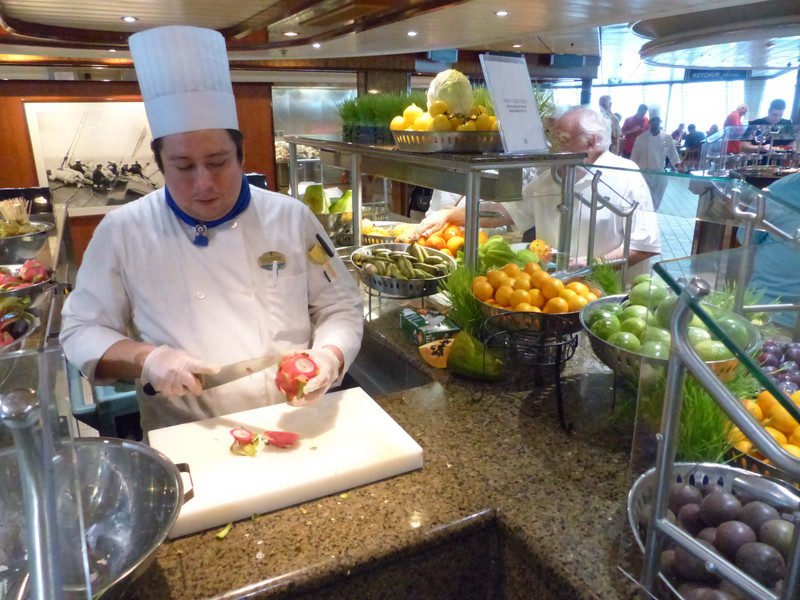 Chef slices exoctic fruits