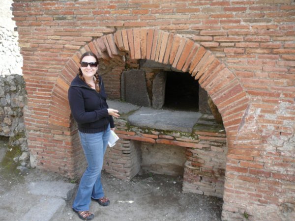 Trish at the pizza oven at Pompeii's bakery