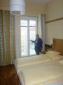 Mom showing off our new room in Vienna