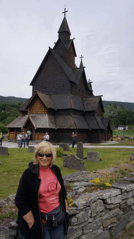 Mom Standing in Front of Heddal Stave Church. 