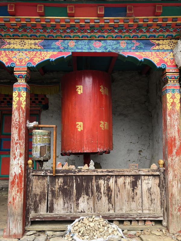 Large prayer wheel in small Gompa we past