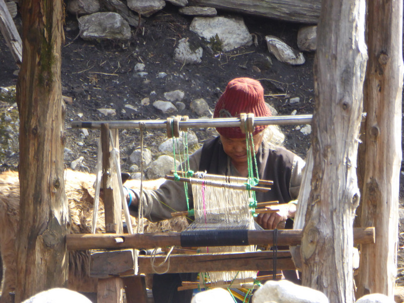 Lady at loom in Sama village