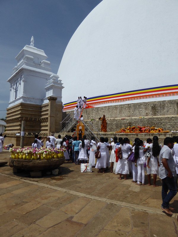 Ribbon being wrapped around the stupa