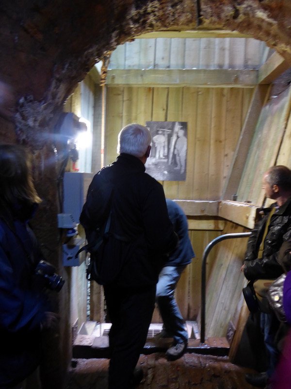 Inside the mine, looking at the device that took the men up and down the shaft