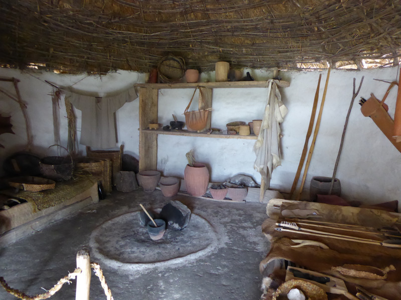 Inside one of the Neolithic huts, showing the tools and utensils of everyday life