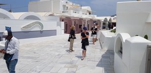 The marble walkway in Oia is blinding with glare