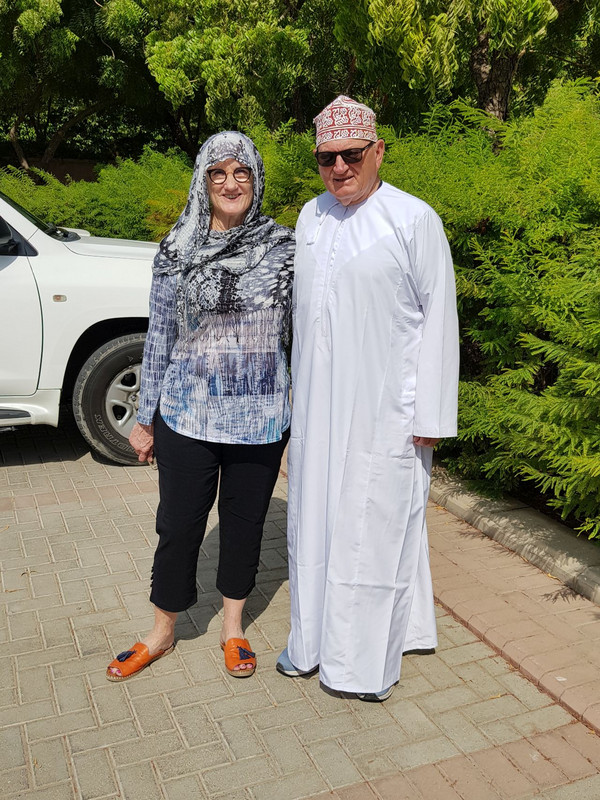 Appropriately dressed for entry to the Grand Mosque in Muscat