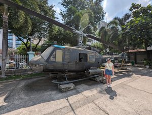 97 - Lucy with a Huey helicopter at the War Remnants Museum