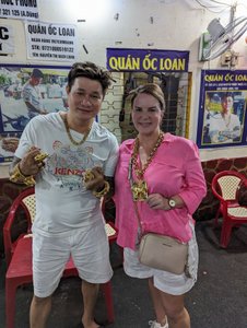 111 - The seafood stop and Megs posing with the owner.  The gold is real.  Apparently the guy is a gangster