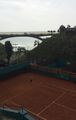 Tennis on red clay by the ocean