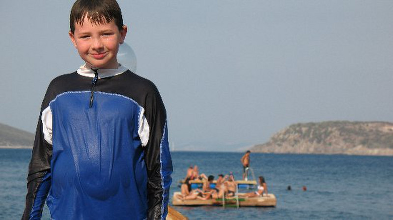 Josh with babe raft in bg