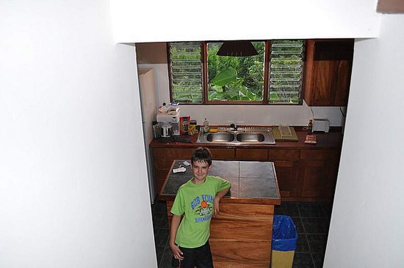 View down stairs of Alex and our kitchen