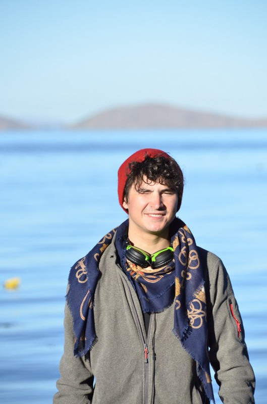 Alex in front of lake Titicaca at 7:30 AM