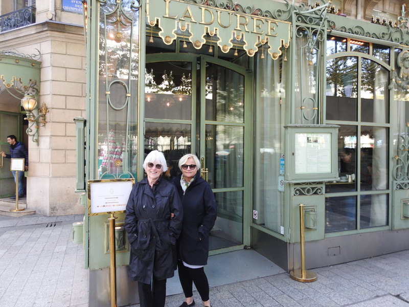 Looking fabulous at the famous "macaron" shop on the Champs Elysees 