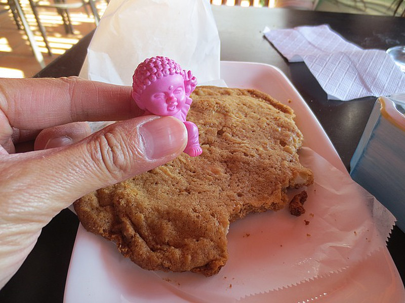 Buddha Hovering Over a Giant Macadamia Nut Cookie