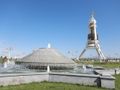 Turkmenbashi&#39;s golden statue and one of many fonts