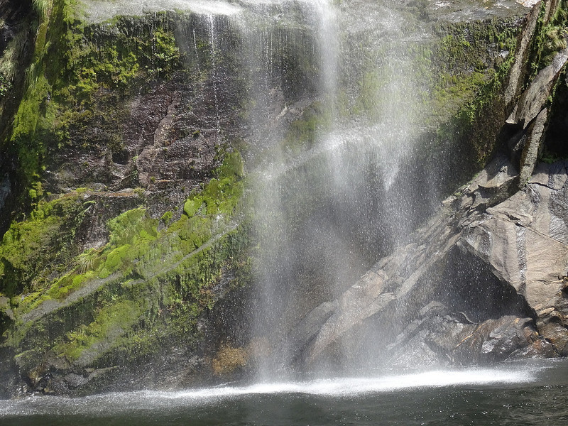 Fairies dancing at bottom of waterfall 
