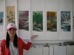 Student from Xian showing her artwork at FC