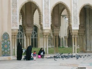 Women feeding pigeons at the Mosque