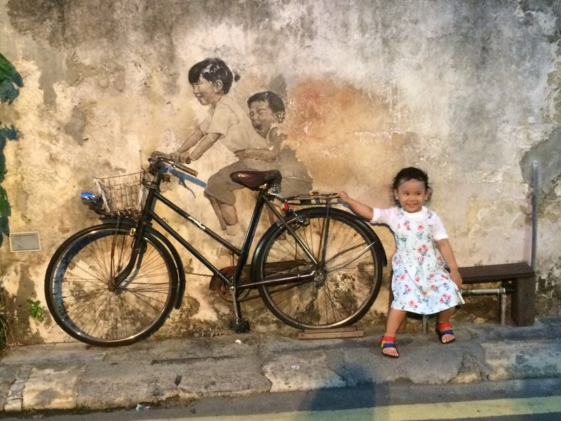 Art in Streets of Georgetown with little girl