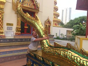 Ron pulling Dragon tail at Thai Buddhist temple - Penang
