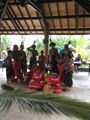 Easo, Lifou, New Caledonia - Dancers with palm leaf in foreground