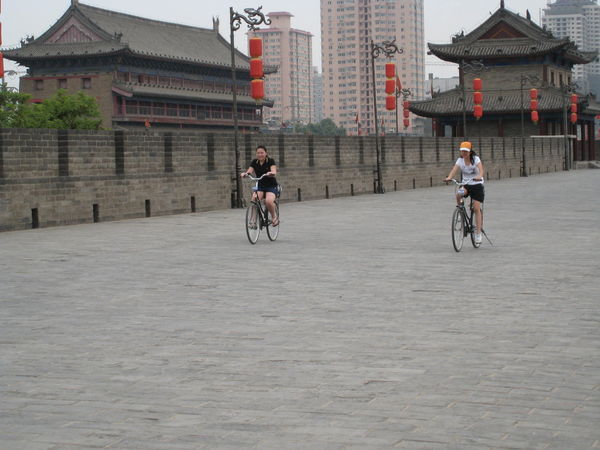 Hong Kong students ride bikes on the Xian City Wall