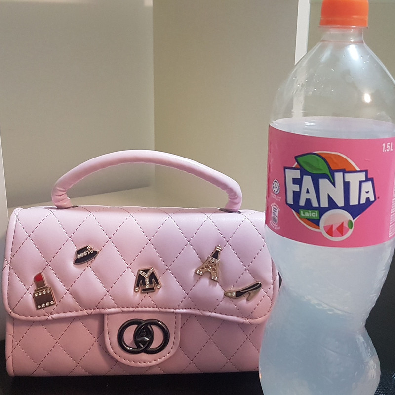 Cute pink bag and lychee Fanta yum 