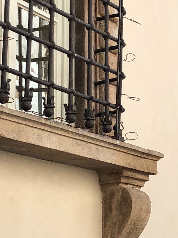 windows with candle holders for Feste San Croce—Lucca