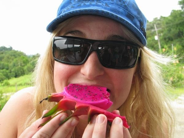 Jaime munches into some dragon fruit