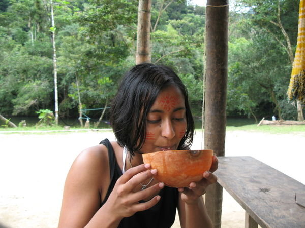 Drinking chicha before heading out into the jungle