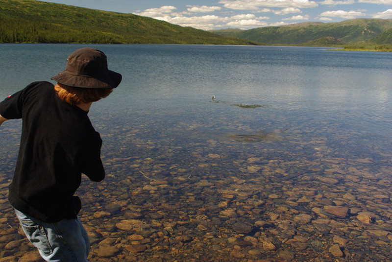 Caleb skipping rocks on Wonder Lake
