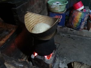 Sticky rice being steamed for monks