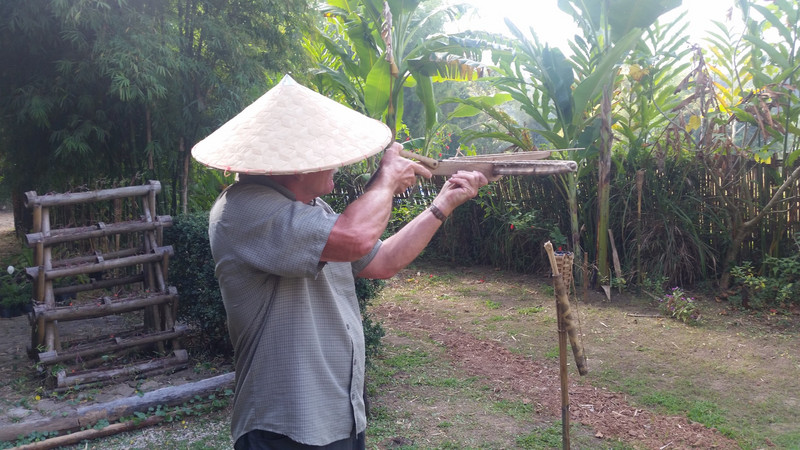Ian having a go with a bamboo crossbow