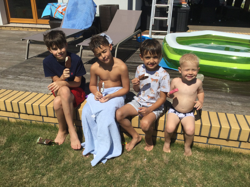 Aidan, Nicholas, Max from next door, and Alexander taking a break from swimming