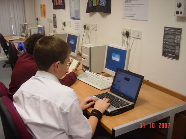 Year 7 with his new laptop.