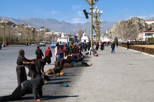 Pilgrims pray outside Potala Palace