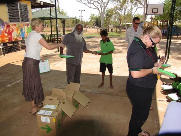 Principal hands out XO's at Nullagine
