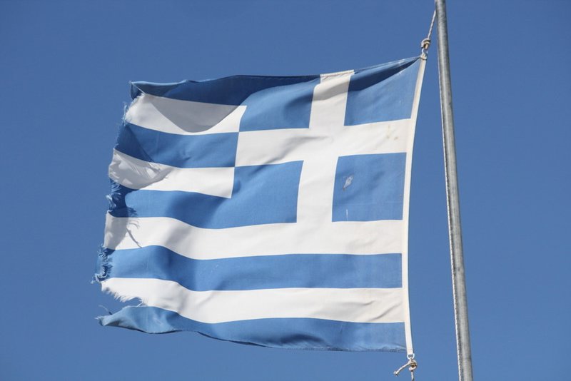 Greek flags fly everywhere.
