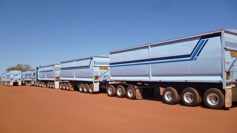 Road trains parked at a roadhouse.