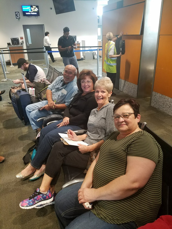 Susan, Renee, Terri and Mike waiting for boarding call