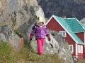 Little Inuit girl playing on the hill