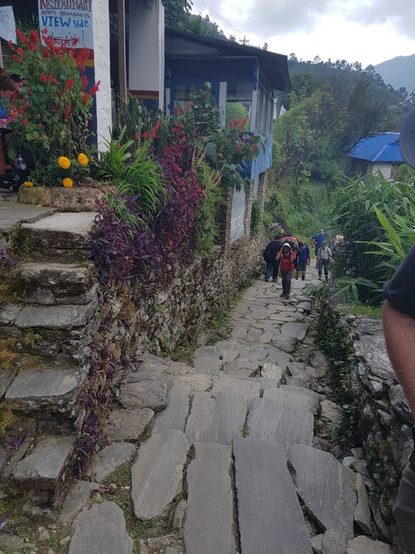Porters coming up, trough the village