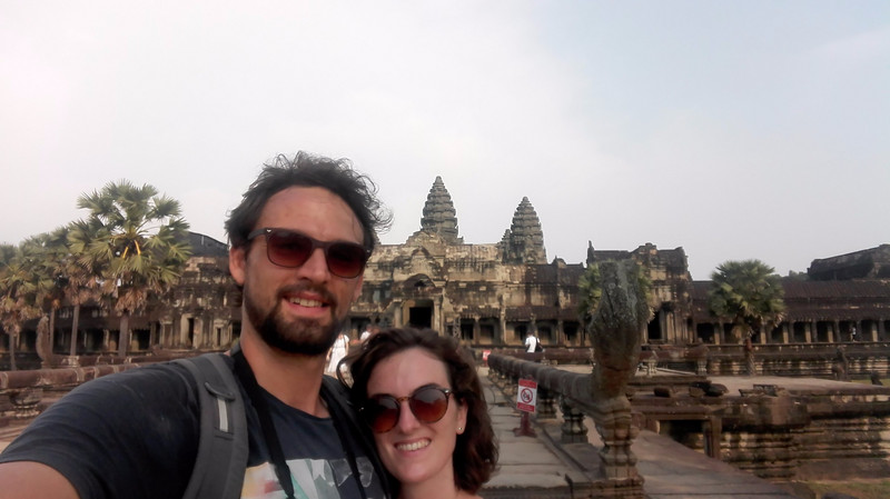 Two annoying tourists taking selfies at Angkor Wat