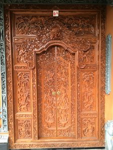 Carved wooden door at one of our hotels