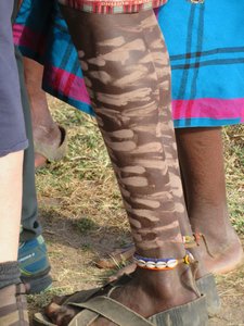 Detailed painting on Masai Mari leg