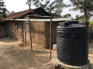 Water tank and typical Kenyan rural building