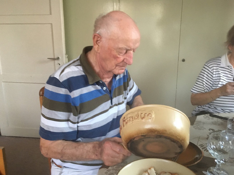 Switzerland - Pete's dad, cleaning out the fondue pot