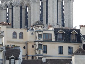 Old house in Paris, with Notre Dame in background